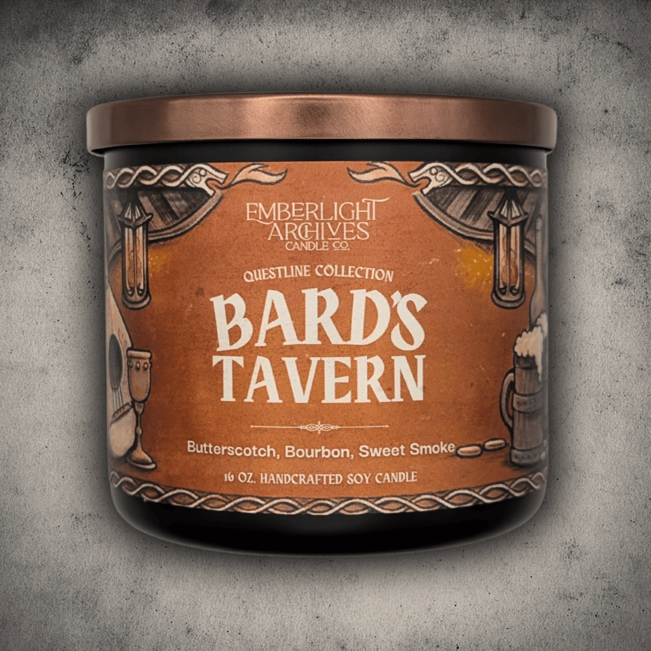 Emberlight Archives Bard's Tavern candle in a 16oz black glass jar with illustrated rustic tavern label against a gray stone background, Butterscotch and Bourbon scent.